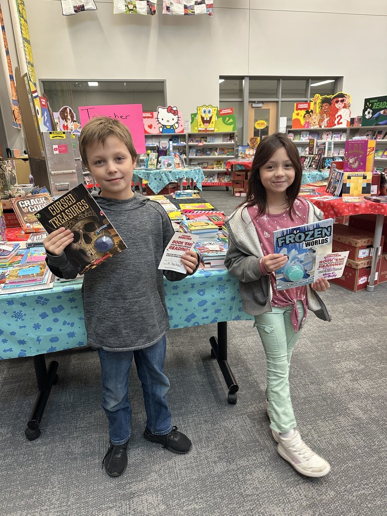 These friends were caught reading and won a free book from the book fair! Thanks to everyone who supported our book fair to support our readers and our library!
