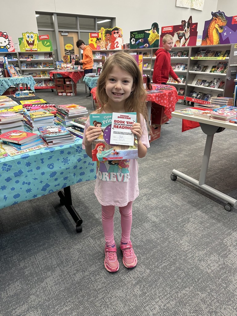 These friends were caught reading and won a free book from the book fair! Thanks to everyone who supported our book fair to support our readers and our library!