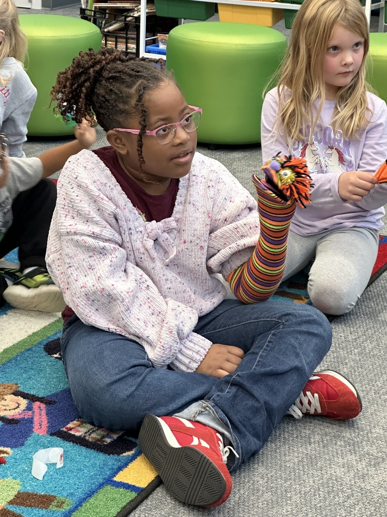These kindergartners LOVED telling stories and using puppets with Ms. Nancy in library media class.