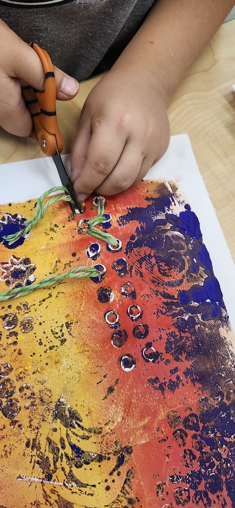 In art, 3rd graders had fun layering on top of their monoprints/gelli prints with stitching today. I love how thoughtful they were about where they placed the stitching.