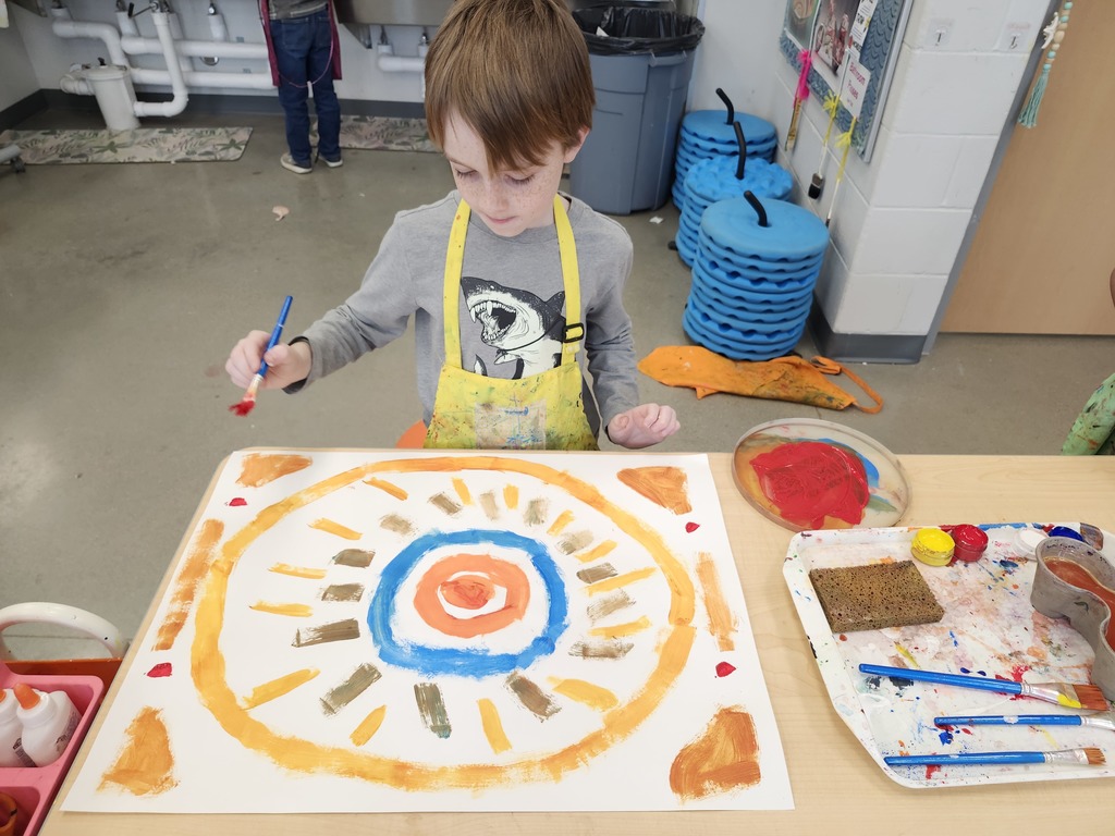 3rd graders practiced mixing colors and creating brushstrokes for radial designs.