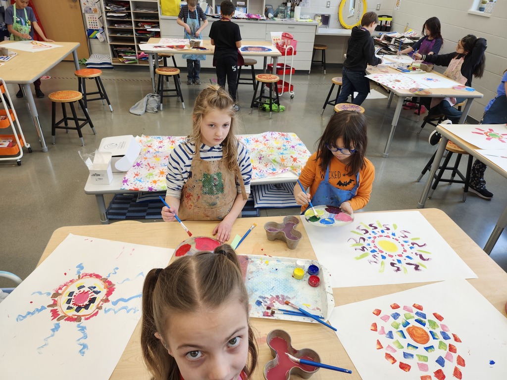3rd graders practiced mixing colors and creating brushstrokes for radial designs.