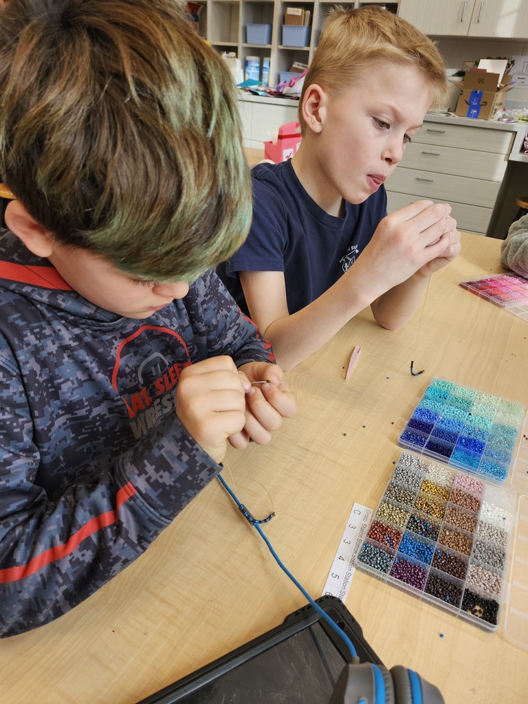 When we had to cancel the 4th grade fieldtrip to the Walker Arts Center to see the Dyani White Hawk exhibit, Mrs Malphurs decided to bring the Walker to LeSueur! Students rotated through stations to try beading, painting tiny brush strokes, looking at the exhibit catalog, watching a video about her 8'×12'beaded work, and looking at photos and videos of the show. The students were rock stars discussing the work with each other. The experience concluded with a virtual tour from the museum education department with the students on Friday. They impressed the museum staff and made LSHE proud!