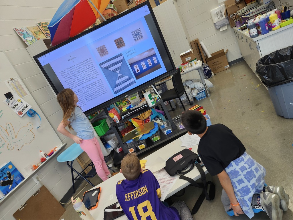 When we had to cancel the 4th grade fieldtrip to the Walker Arts Center to see the Dyani White Hawk exhibit, Mrs Malphurs decided to bring the Walker to LeSueur! Students rotated through stations to try beading, painting tiny brush strokes, looking at the exhibit catalog, watching a video about her 8'×12'beaded work, and looking at photos and videos of the show. The students were rock stars discussing the work with each other. The experience concluded with a virtual tour from the museum education department with the students on Friday. They impressed the museum staff and made LSHE proud!