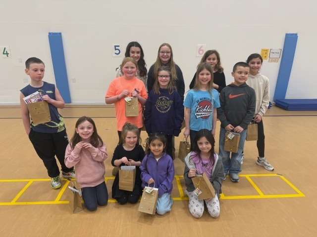 IMG_1713"Reading is Full of Surprises" was the theme this year at LSH Elementary as we celebrated I Love To Read Month! We had a surprise visit from Julie Gassman, a local author from St. Peter. Michael Callahan, a local magician, shared his magic tricks with K-5 earlier this month. Our grand celebration took place March 2 with a surprise visit from a local juggler, Adam St. Pierre! Students learned that reading can take us many places and we can learn many tricks when reading! Top readers from each class received some wonderful prizes. The Bar and Grill donated a free personal pan pizza. 300 Club donated a free game of bowling. Each top reader received a token to use in our new book vending machine that was donated from Le Sueur Rotary Club. A BIG SHOUT OUT to The Bar and Grill, 300 Club, and Le Sueur Rotary Club for all your support and generous donations. Congratulations to all our readers - Keep on reading and enjoying the surprises!