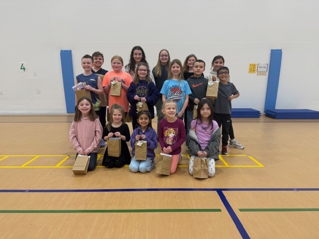 IMG_1713"Reading is Full of Surprises" was the theme this year at LSH Elementary as we celebrated I Love To Read Month! We had a surprise visit from Julie Gassman, a local author from St. Peter. Michael Callahan, a local magician, shared his magic tricks with K-5 earlier this month. Our grand celebration took place March 2 with a surprise visit from a local juggler, Adam St. Pierre! Students learned that reading can take us many places and we can learn many tricks when reading! Top readers from each class received some wonderful prizes. The Bar and Grill donated a free personal pan pizza. 300 Club donated a free game of bowling. Each top reader received a token to use in our new book vending machine that was donated from Le Sueur Rotary Club. A BIG SHOUT OUT to The Bar and Grill, 300 Club, and Le Sueur Rotary Club for all your support and generous donations. Congratulations to all our readers - Keep on reading and enjoying the surprises!