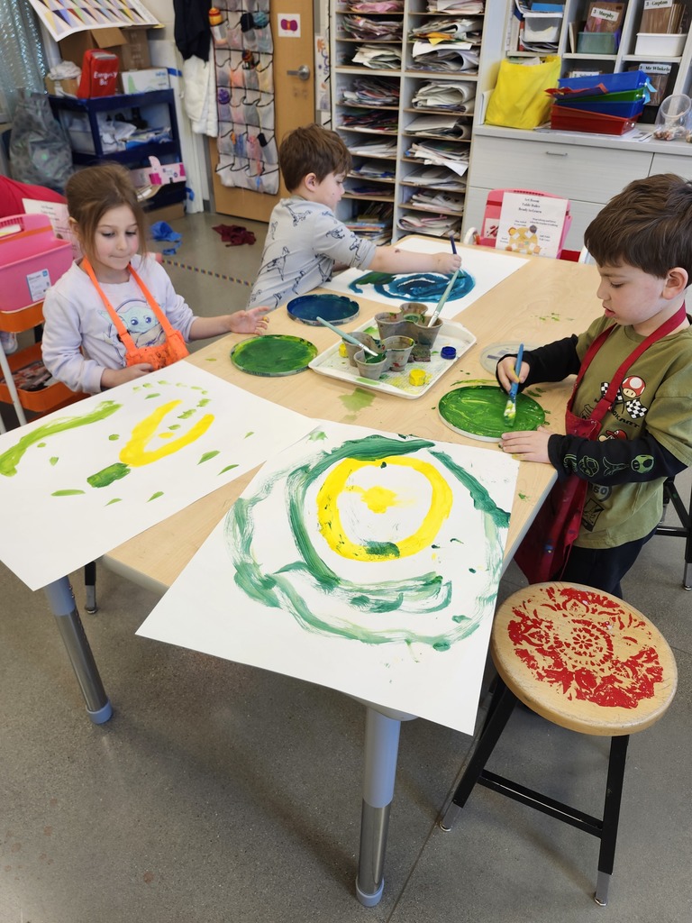 Wow nothing says spring like these beautiful green paintings!  Kindergartners explored mixing blue and yellow to make a variety of greens. I love the happy sounds of color mixing exploration..."Wow look at THIS green!" "Whoa that green is so dark!" "Look at that bright yellow green she made! " "Our water is all green now!" Such joy!