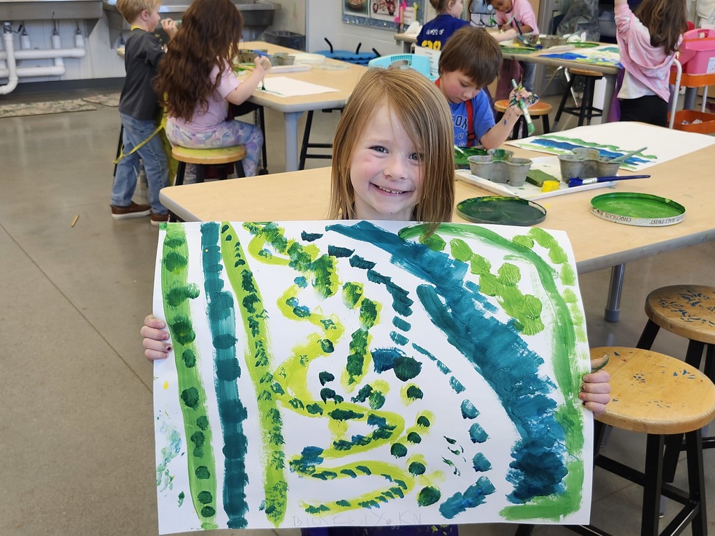 Look at these proud Kindergarten faces! Mixing green is so much fun!