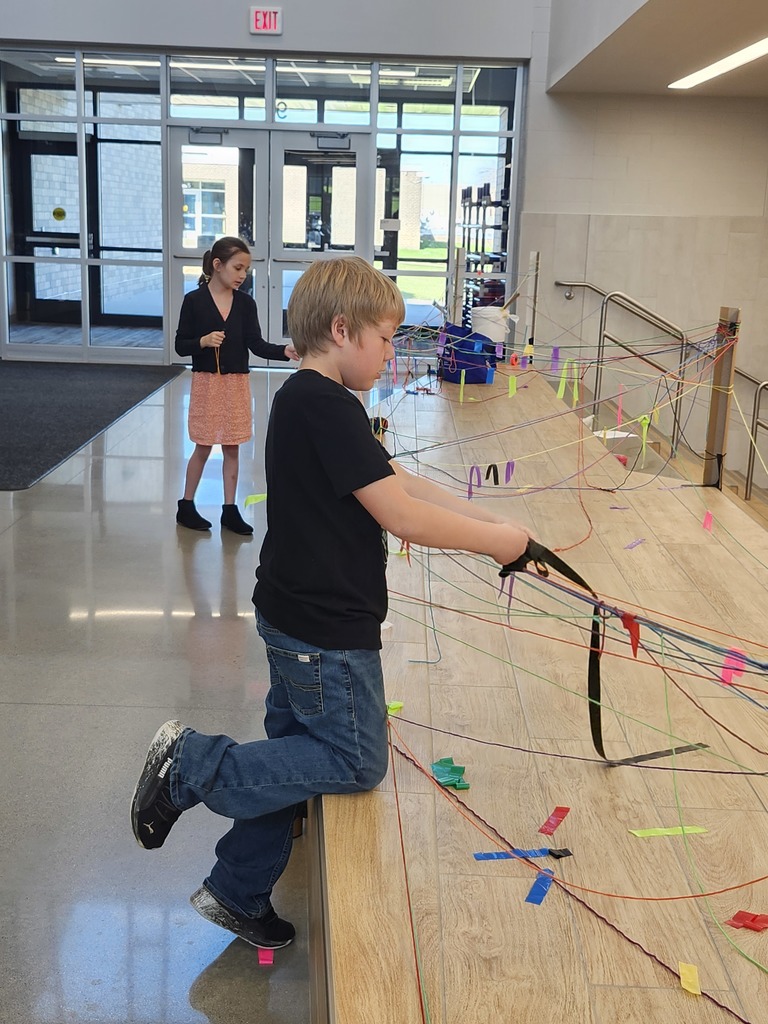 Students in K-2 are learning about temporary art by exploring with yarn bombing. What a fun time we had!