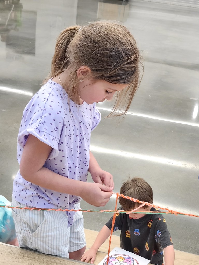 Kindergartners explored temporary art today. Look at the careful wrapping of the yarn! 