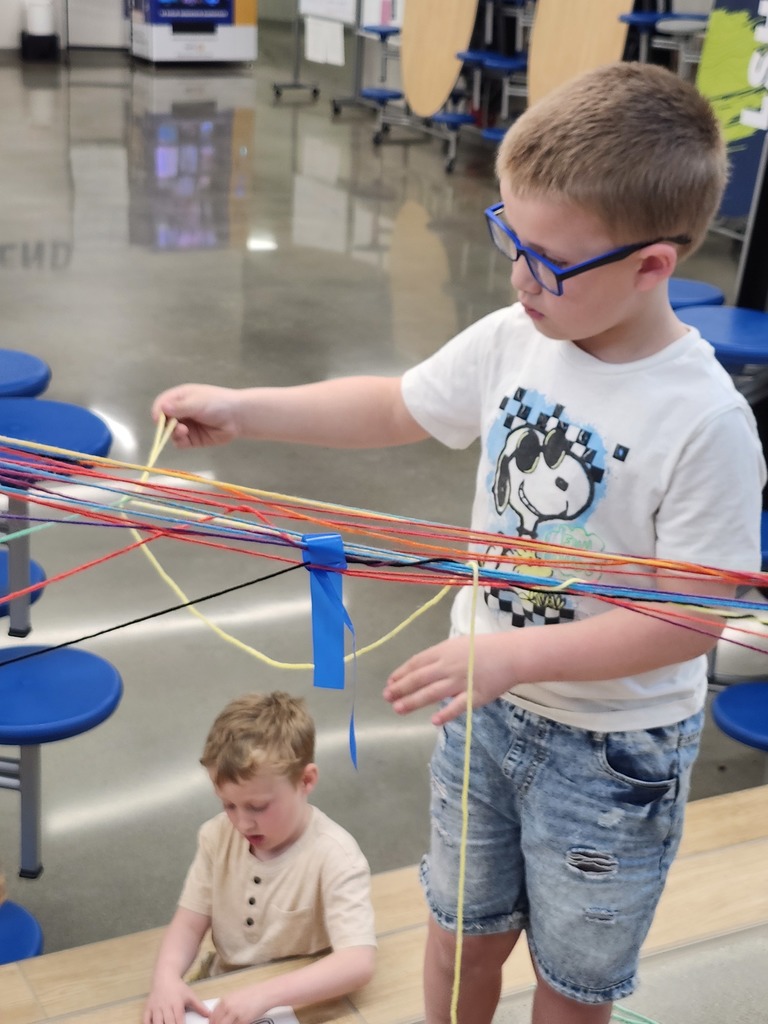 Kindergartners explored temporary art today. Look at the careful wrapping of the yarn! 