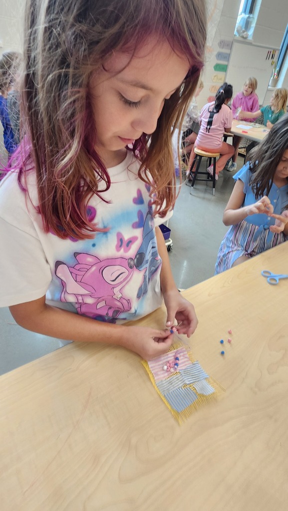 We started this year a little different in art Students have been asking to learn to sew so we made fabric collages with their names on them. Pictured 5th graders and their work. 