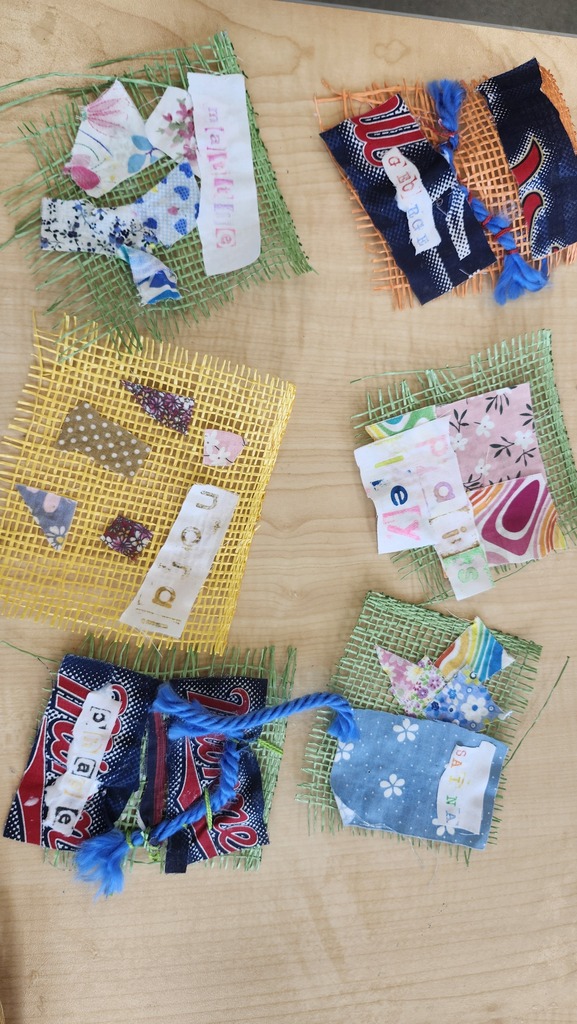 We started this year a little different. Students have been making fabric collages with their names on them. Pictured 2nd graders and their work. 