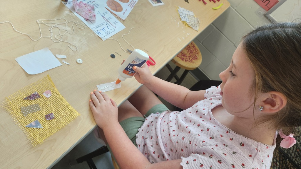 We started this year a little different. Students have been making fabric collages with their names on them. Pictured 2nd graders and their work. 