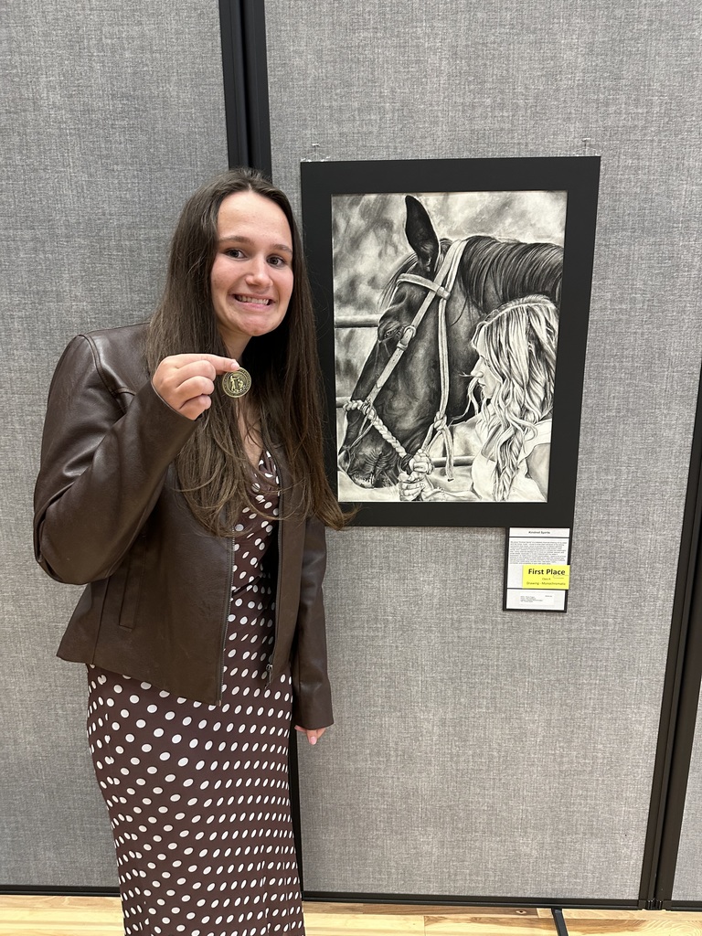 Peyton with drawing and medal