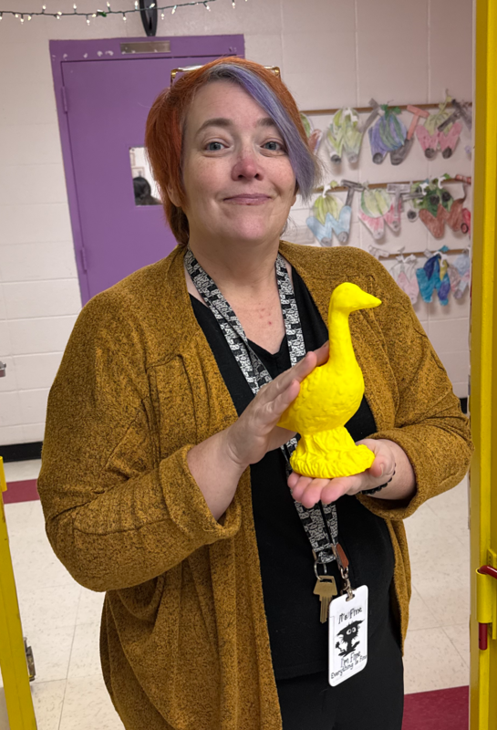 Teacher holding golden goose