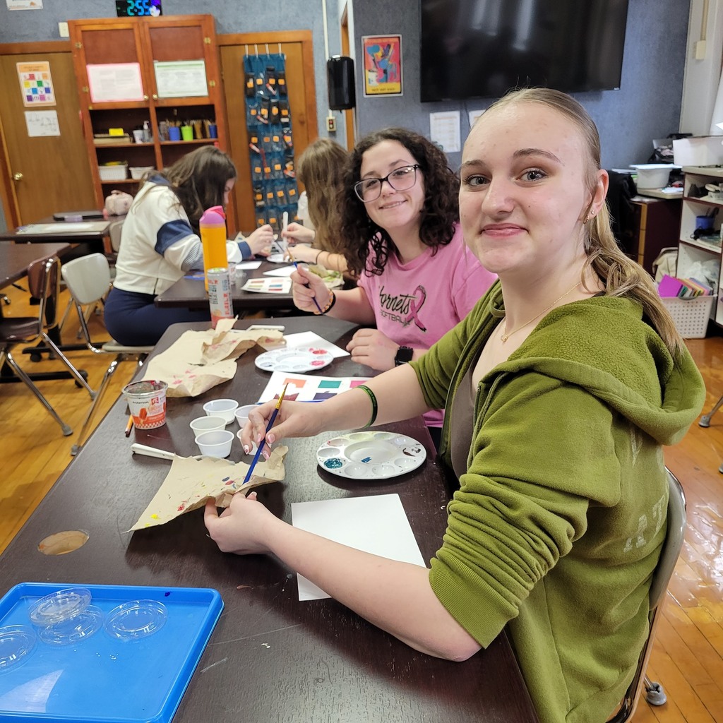 Students are mixing paint.