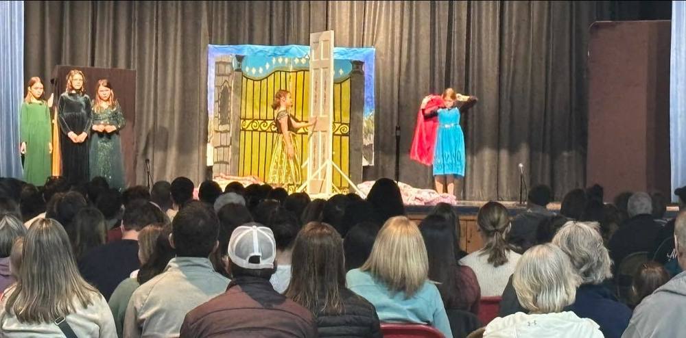 students performing in front of an audience