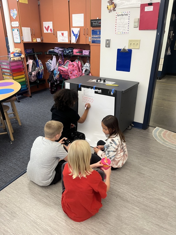 Second Graders using Vertical Boards for Math