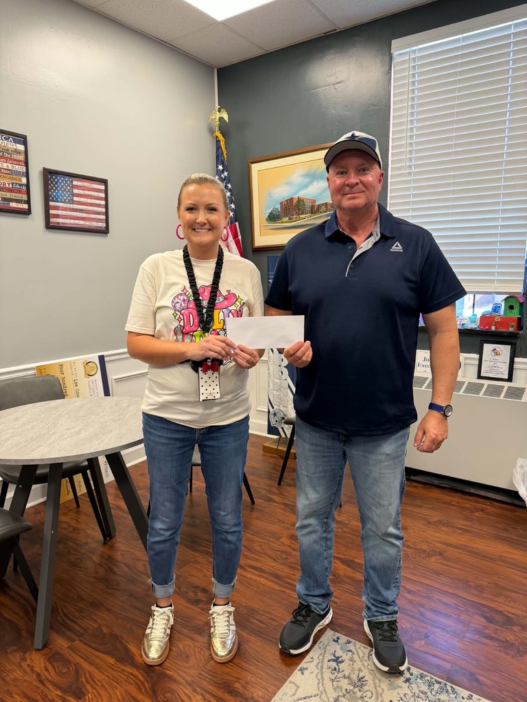 LCE FRC Director, Hillary Best accepts donation from Lee County Fiscal Court and Executive Judge Steve Mays.