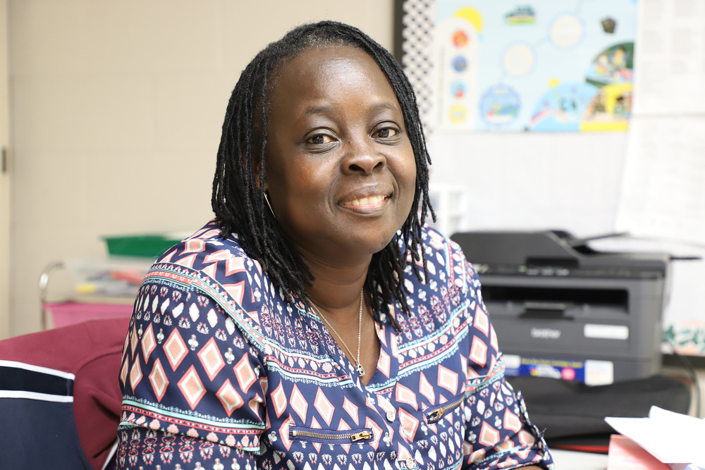 Natalder Butler from JR Ingram sits at her desk
