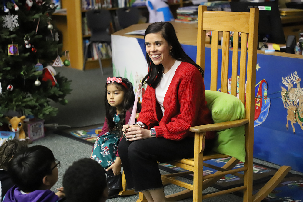 Coggins talks with students at Holiday party