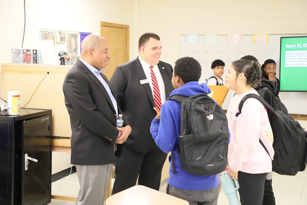 Mo Green, State Superintendent, and Chris Dossenbach, LCS Superintendent talk with students during an english class at west lee middle school