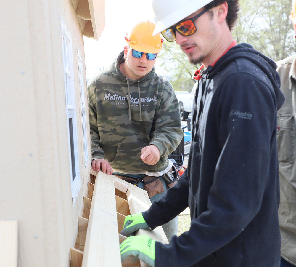 Southern Lee Students work together on building a Chicken Coop in BUILD competition at CCCC Harnett