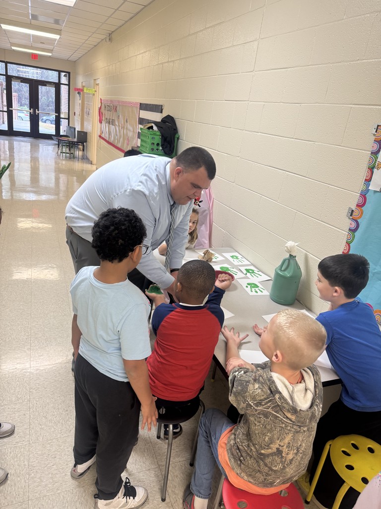 Well-Being Wednesday Post highlighting Dr. Dossenbach engaging in a craft with students at Tramway