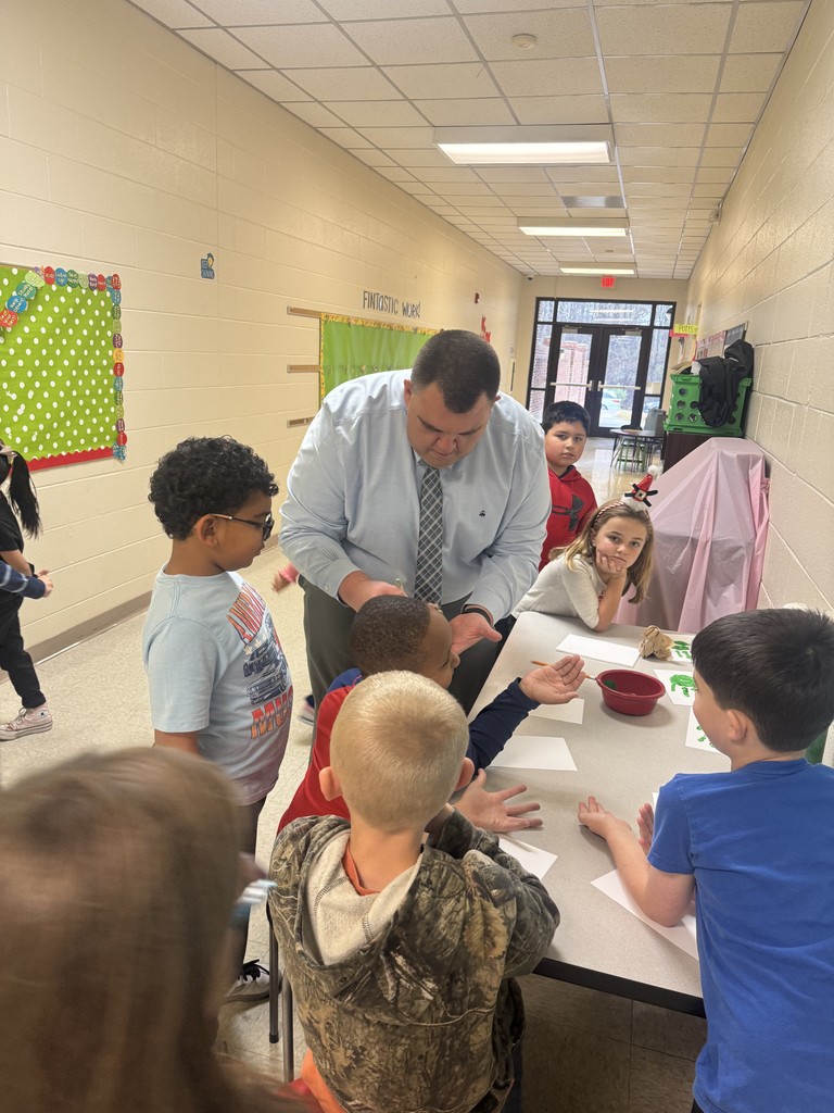 Well-Being Wednesday Post highlighting Dr. Dossenbach engaging in a craft with students at Tramway