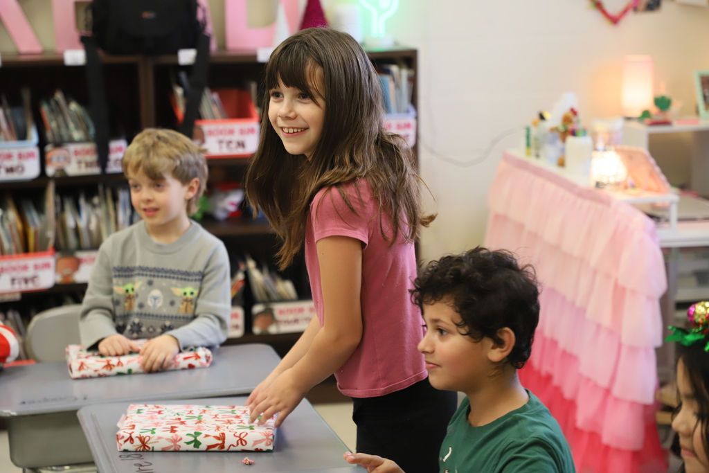 Yolanda Vazquez gifts each student a handmade hat, matching their own design, as a christmas gift from her and her family