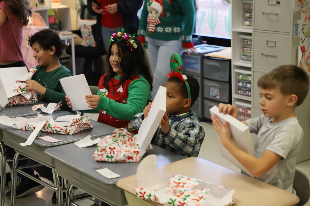 Yolanda Vazquez gifts each student a handmade hat, matching their own design, as a christmas gift from her and her family