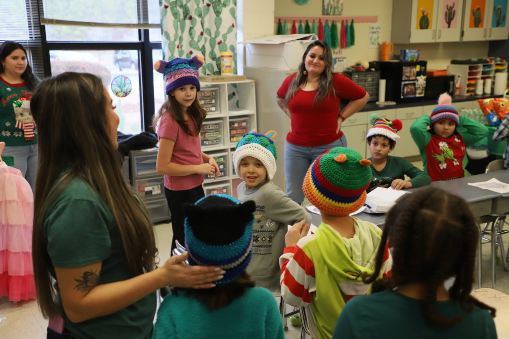 Yolanda Vazquez gifts each student a handmade hat, matching their own design, as a christmas gift from her and her family