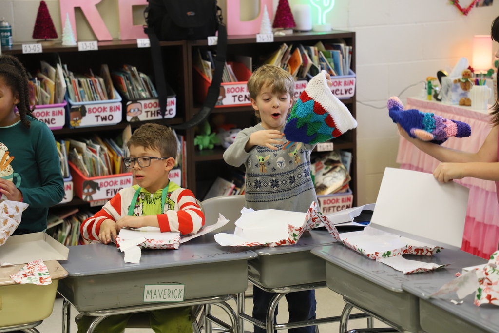 Yolanda Vazquez gifts each student a handmade hat, matching their own design, as a christmas gift from her and her family