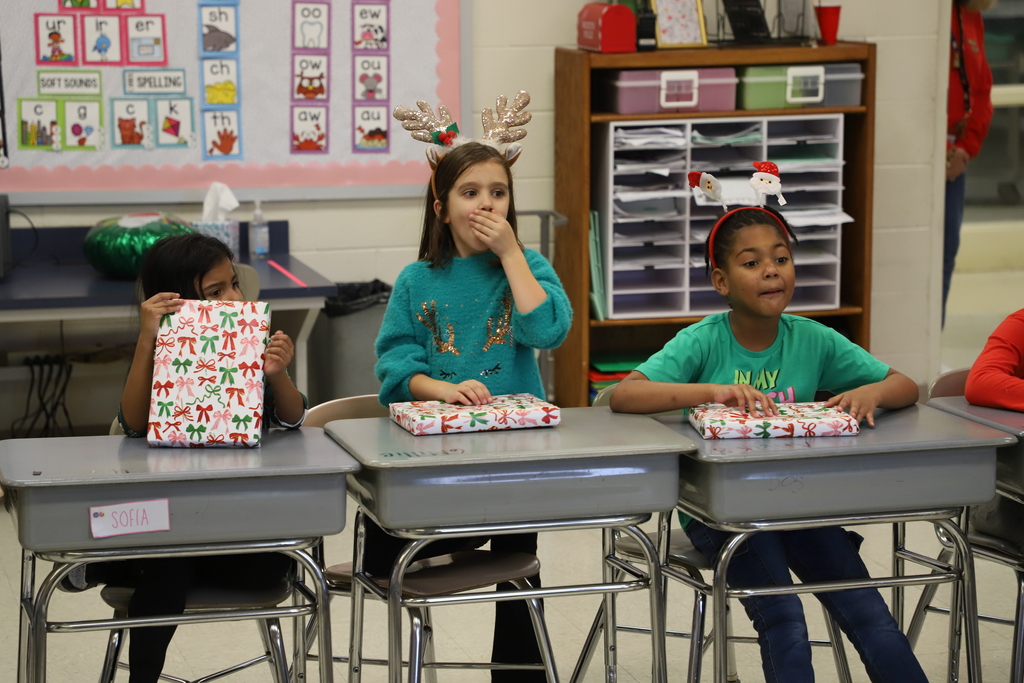Yolanda Vazquez gifts each student a handmade hat, matching their own design, as a christmas gift from her and her family