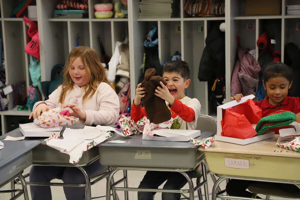 Yolanda Vazquez gifts each student a handmade hat, matching their own design, as a christmas gift from her and her family