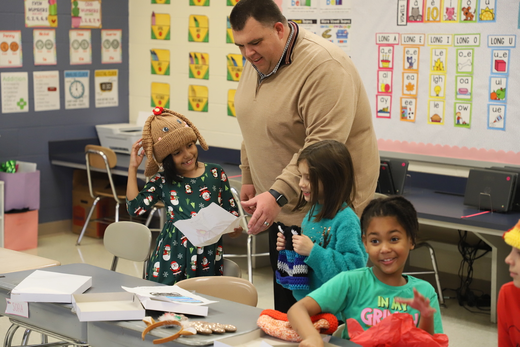 Yolanda Vazquez gifts each student a handmade hat, matching their own design, as a christmas gift from her and her family
