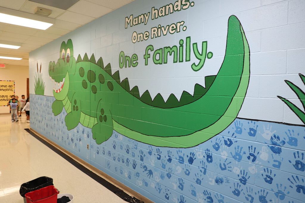 Deep River students participate in making a hand mural