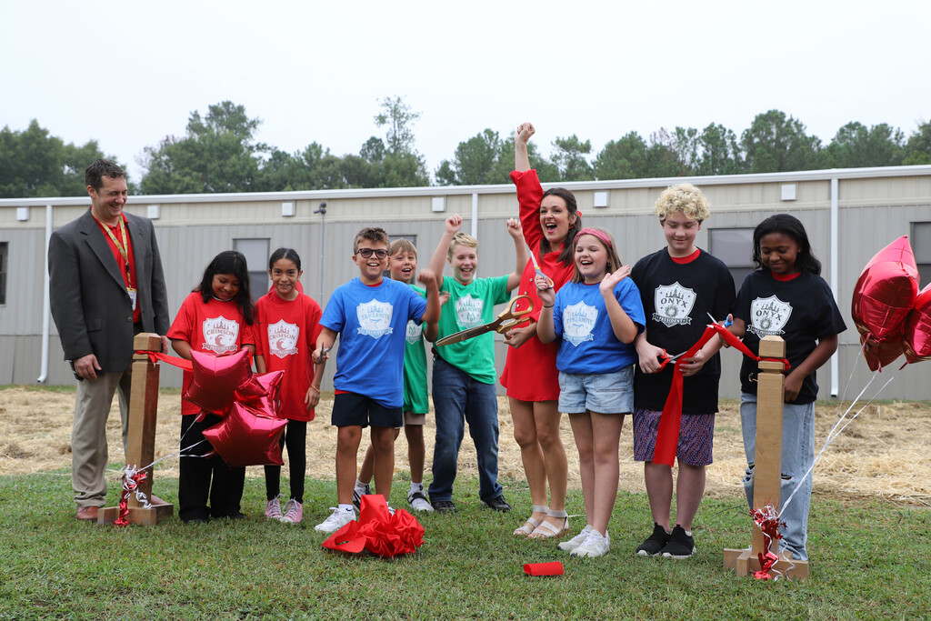 Student leaders at JGE cut the ribbon on the new "Academy" classroom pod at J. Glenn Edwards
