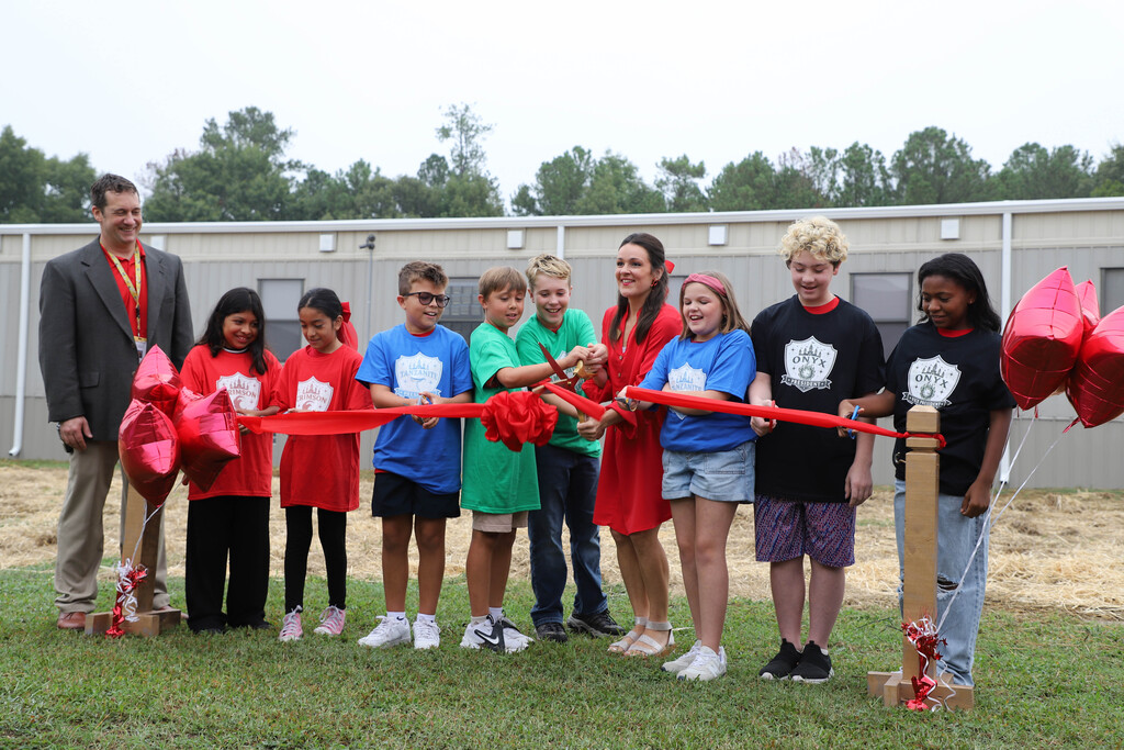 Student leaders at JGE cut the ribbon on the new "Academy" classroom pod at J. Glenn Edwards