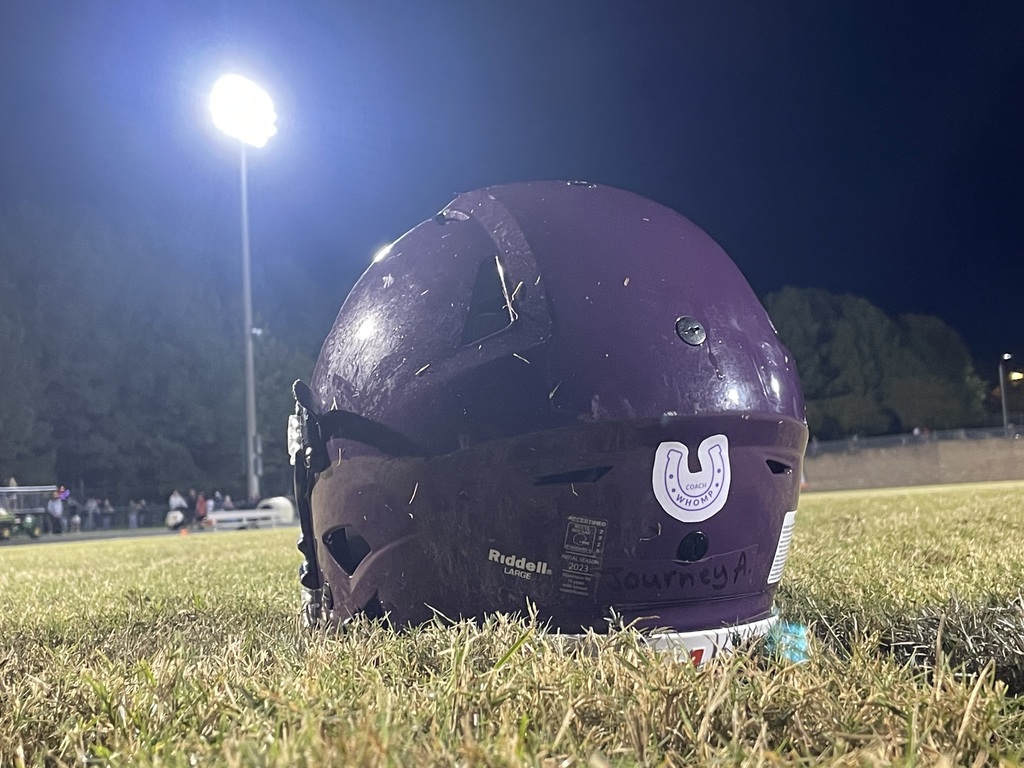 Coach Whomp helmet sticker under the lights