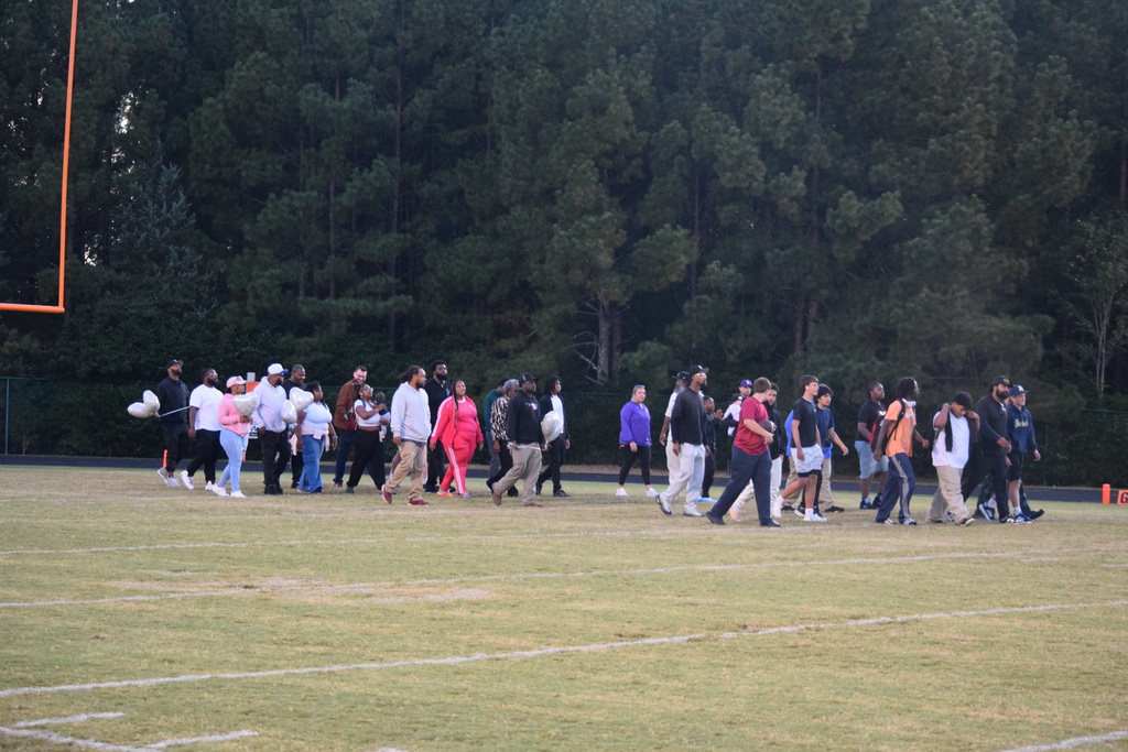 Teams and families gather to remember Coach Whomp