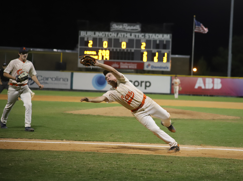 Dallas Roberts dives for a foul pop out to end the fourth inning