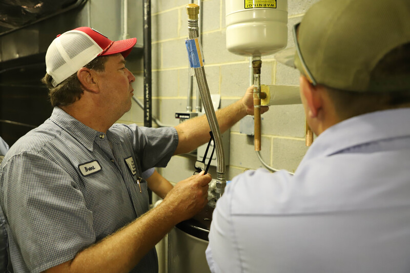 Maintenance Department Workers doing various projects around the district