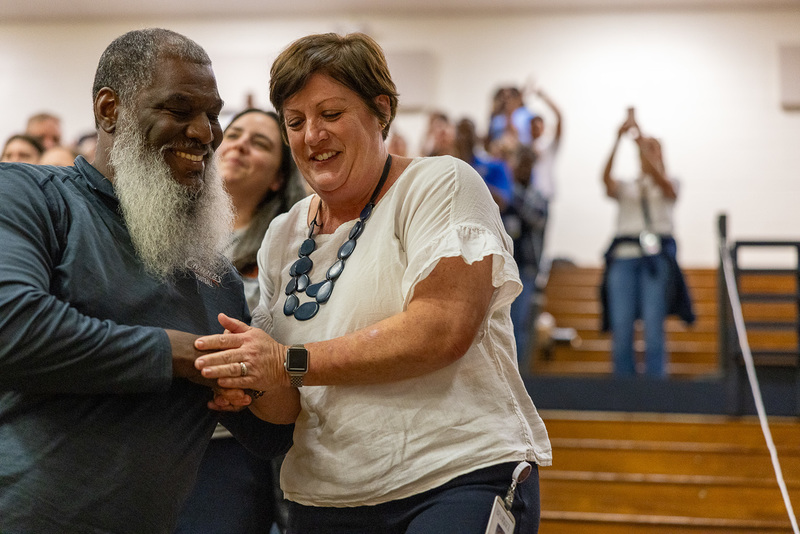 Petrarca shakes hand of Fred Blanks on the way to accept Principal of the Year award