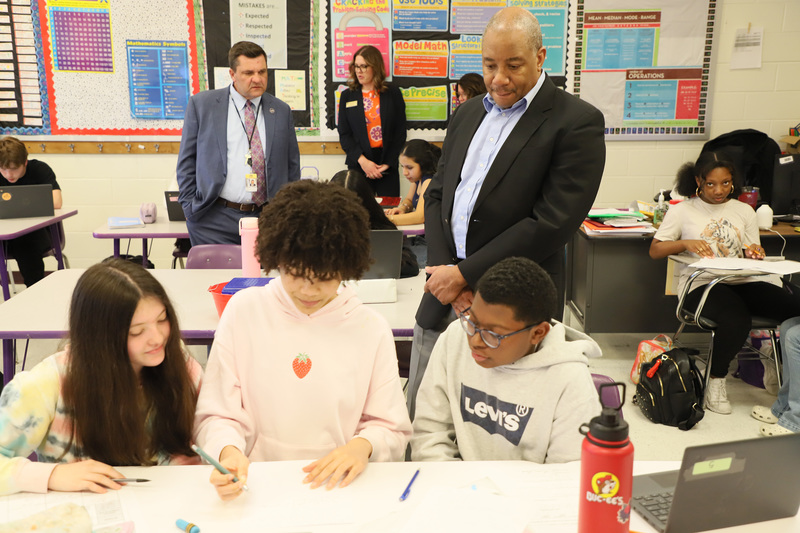 State Superintendent Mo Green looks over student work at SanLee Middle School