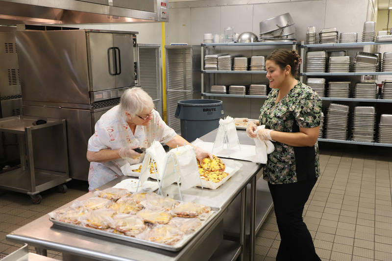 cafeteria workers preparing food for students at BT Bullock