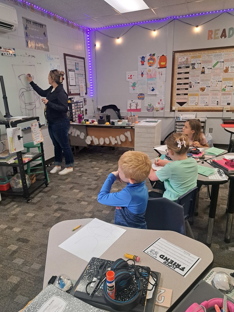 2nd Graders working on an art/writing project