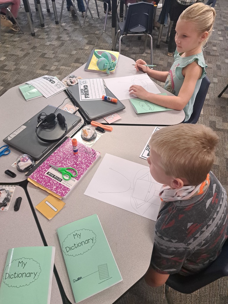 2nd Graders working on an art/writing project