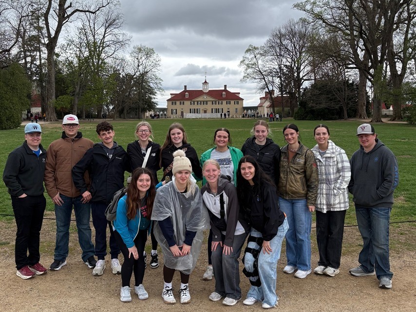 Students at Mount Vernon with George Washington's mansion in the background. 